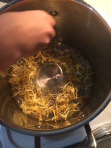 adding honeysuckle around ramekin to bottom of pot